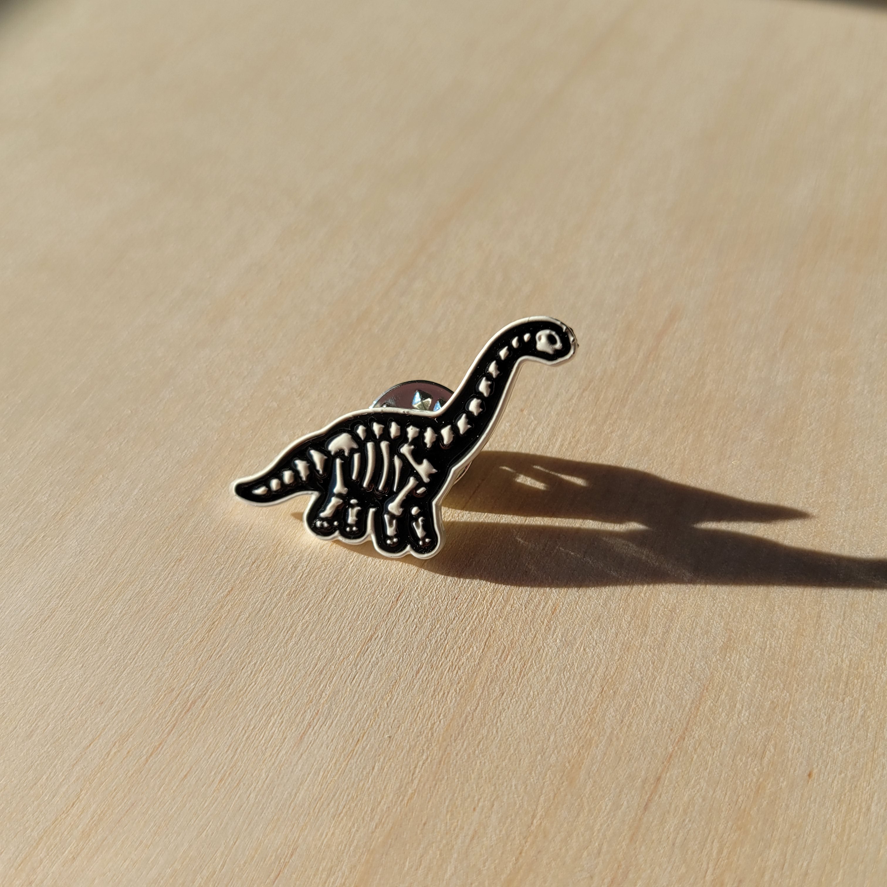 Long Neck Skeleton Dino - Enamel Lapel Pin